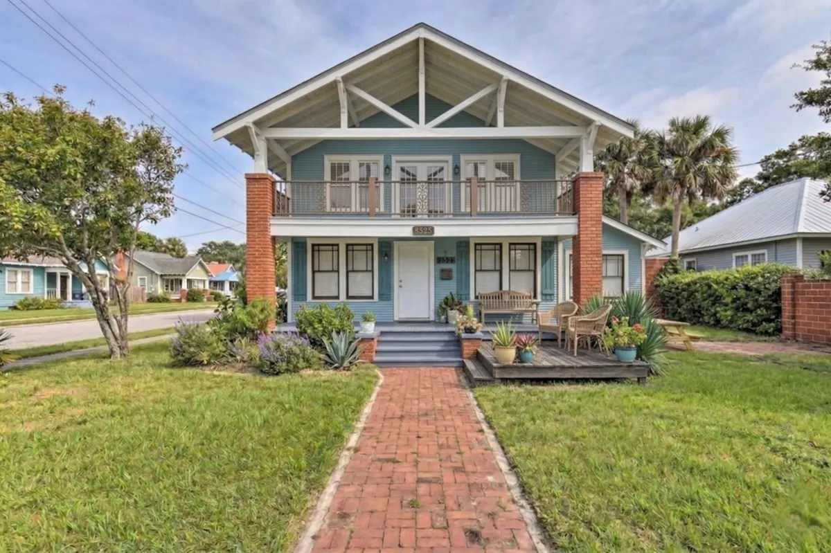 a modern house with a large front yard