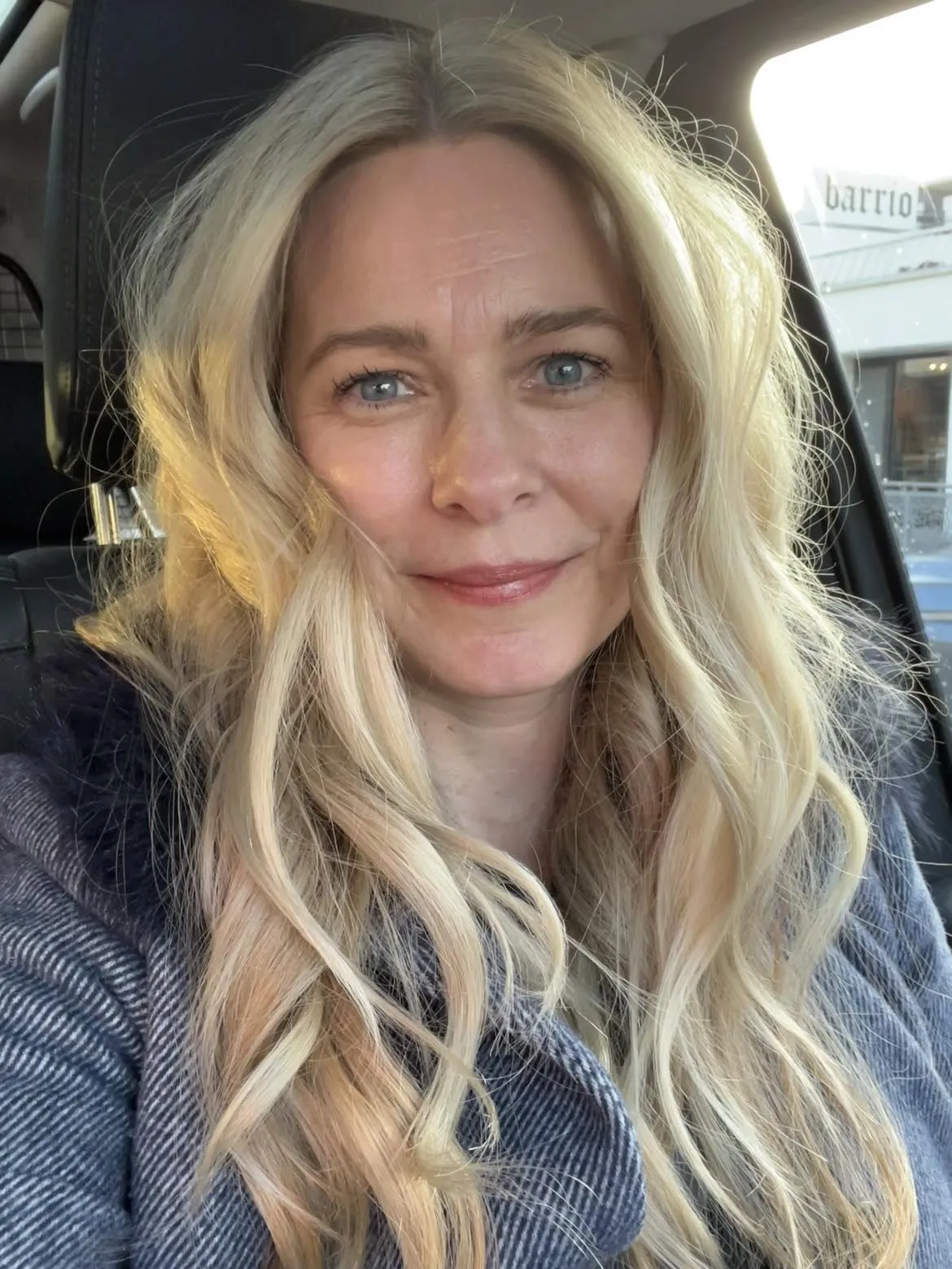 Portrait of Kari Olson smiling in a car