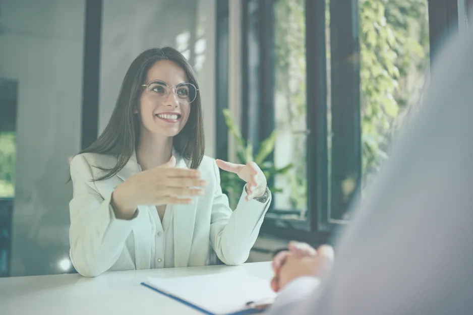 Woman talking during a meeting across a table