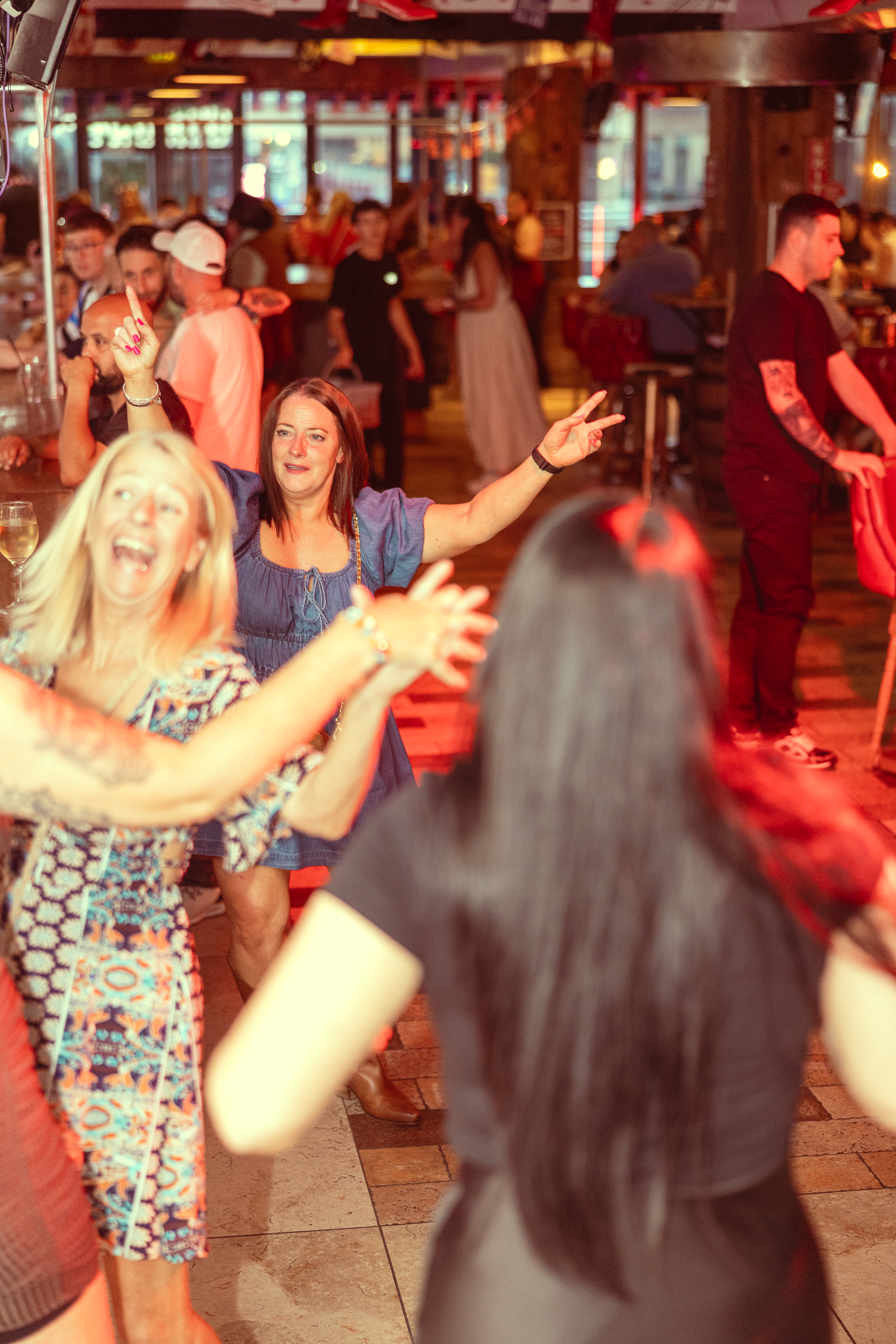 Beginners laughing and having a good time on the country dance floor