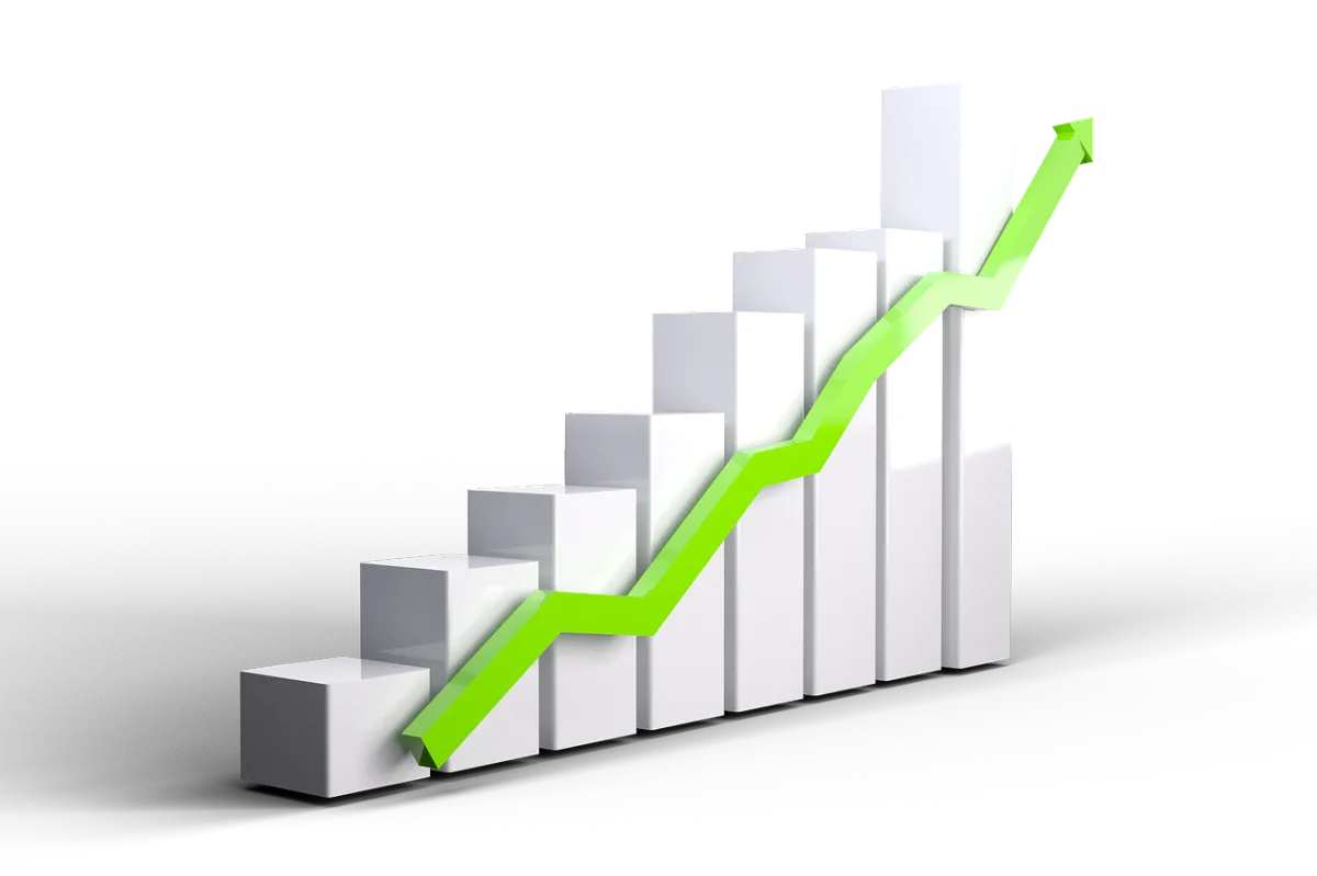 A clean, modern chart visualizes ROI growth over 12 months, with upward-trending bars in blue and teal. The chart is displayed on a digital tablet held by a business professional, with a blurred office background. The focus is on the data and positive trend.