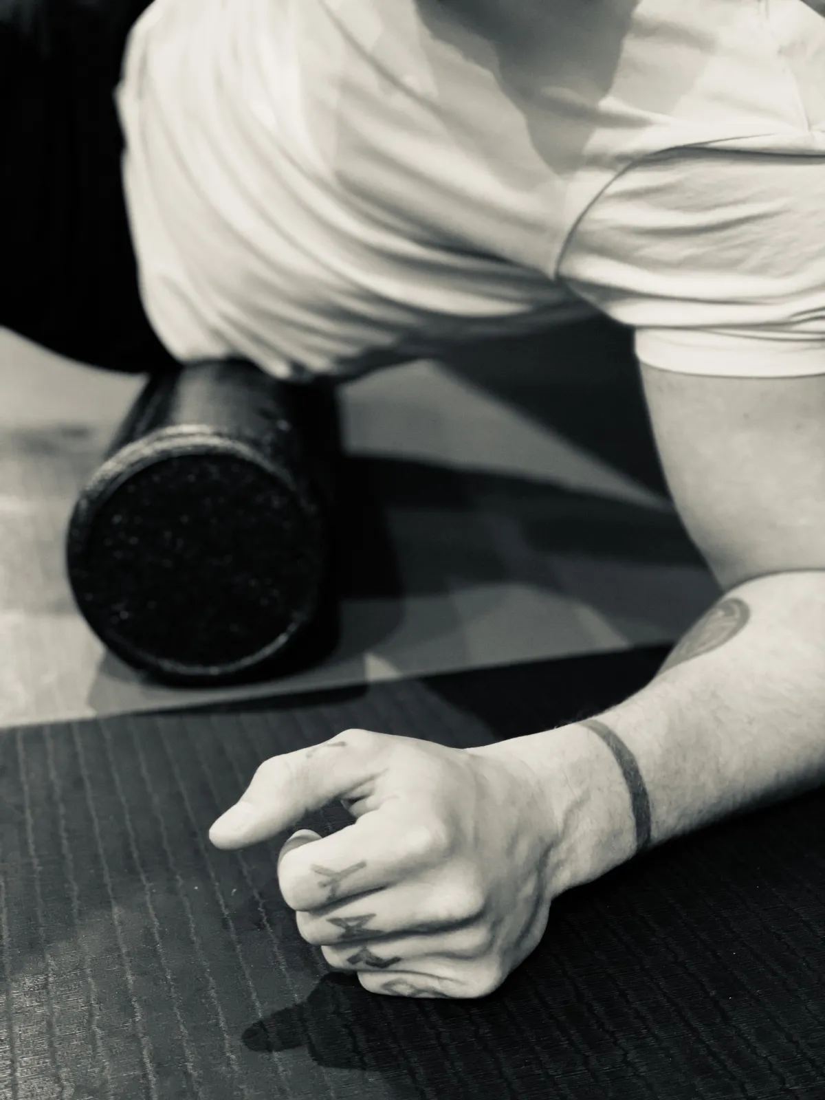 Close-up of foam-roller contact during floor-based practice