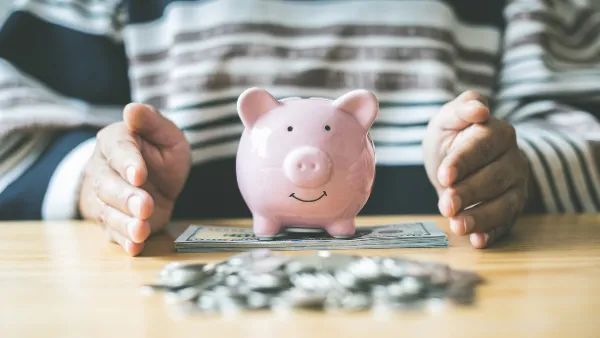 A piggy bank surrounded by money saved.