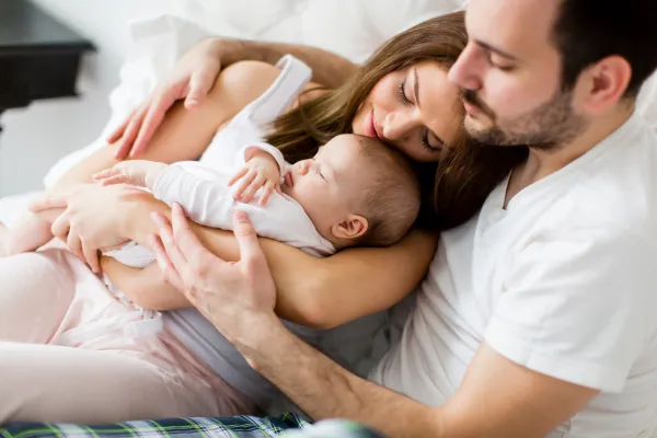 Essential Postpartum Visit - mother with newborn during consult