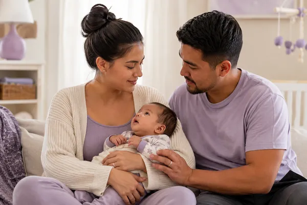 Essential Postpartum Visit - mother with newborn during consult