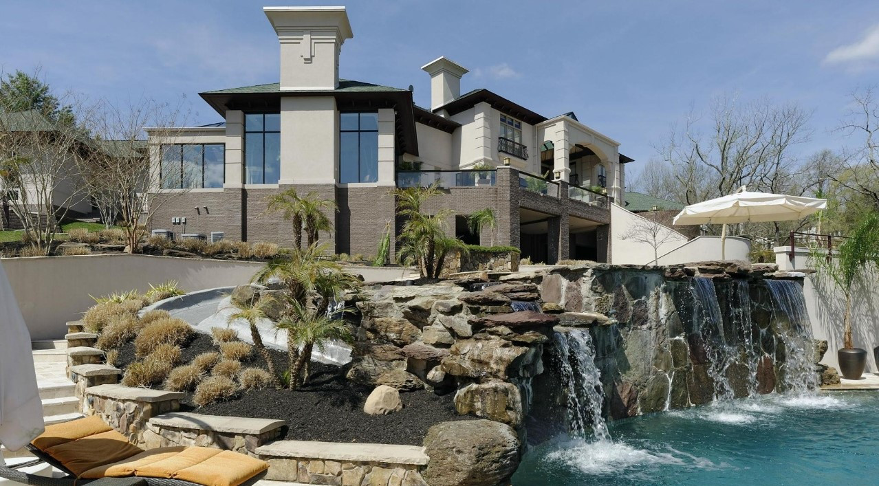 a room with two windows and a toilet