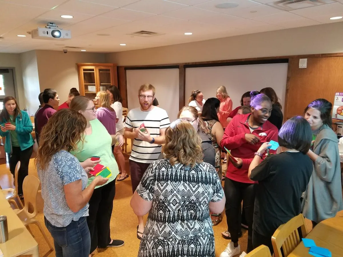 Image of team members going through an exercise together in-person