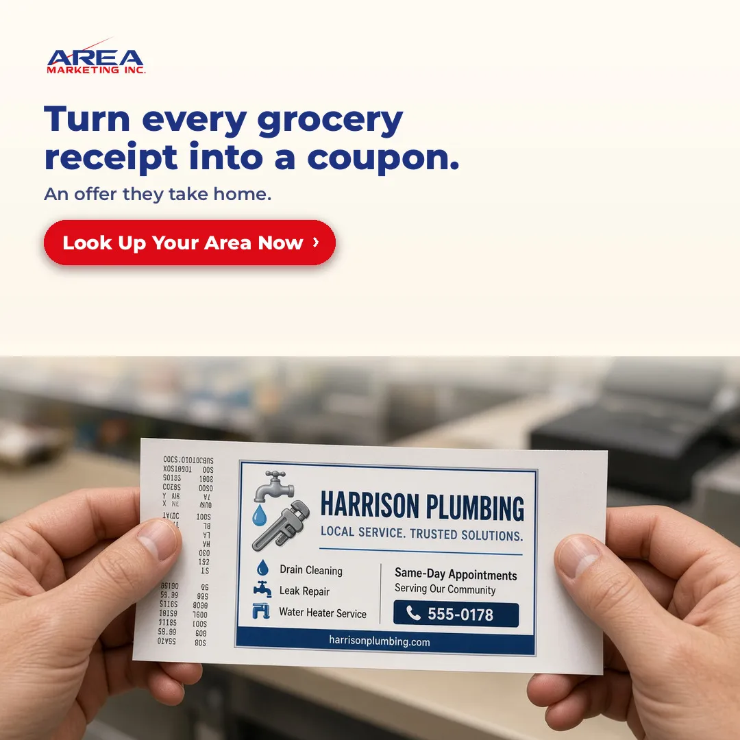 Local business coupon printed on a grocery store receipt