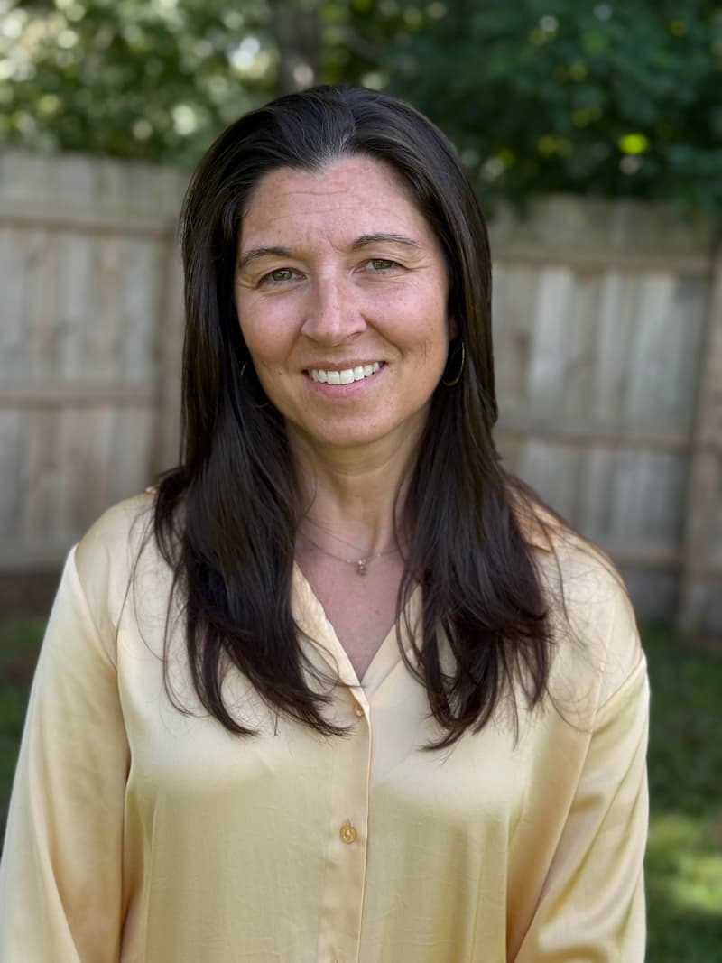 Stacy Sechrist, founder of Sechrist Consulting, LLC, smiling in a warm, professional portrait.