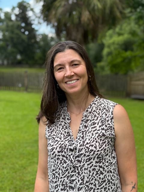 Stacy Sechrist, founder of Sechrist Consulting, LLC, smiling in a warm, professional portrait.