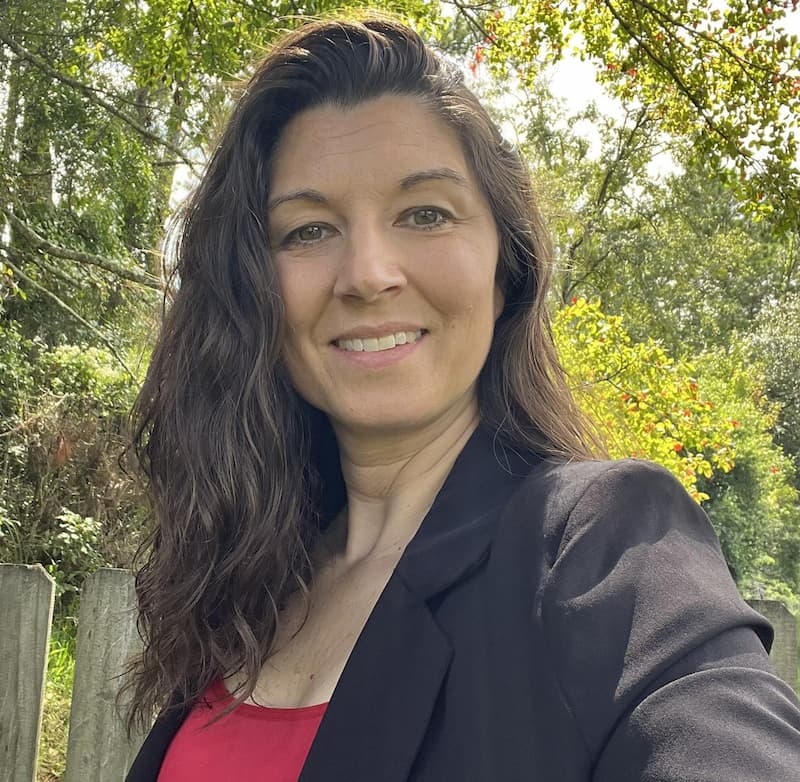 Stacy Sechrist, founder of Sechrist Consulting, LLC, smiling in a warm, professional portrait.