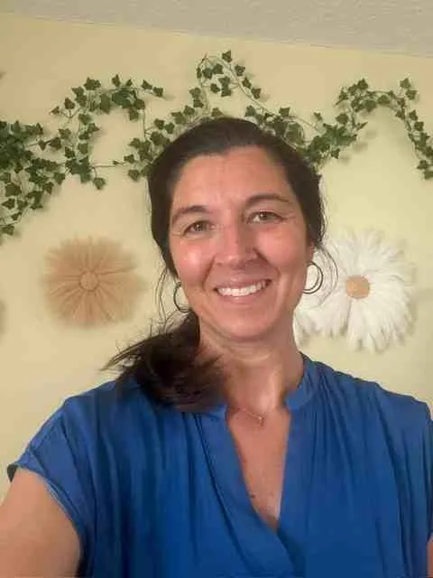 Stacy Sechrist, founder of Sechrist Consulting, LLC, smiling in a warm, professional portrait.