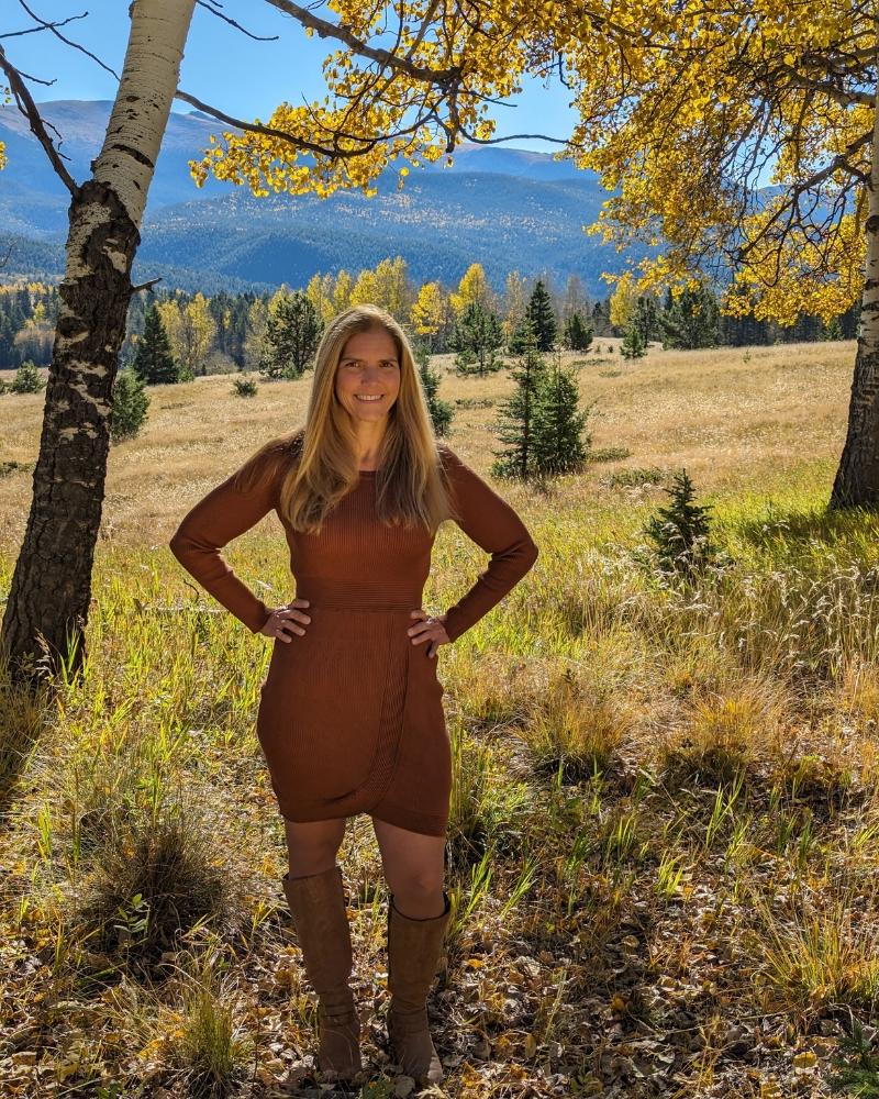 Portrait of Jennifer Guerrero, a trusted Colorado Springs real estate agent and relocation specialist with the Nathan Johnson Team, standing in the local Pikes Peak landscape.