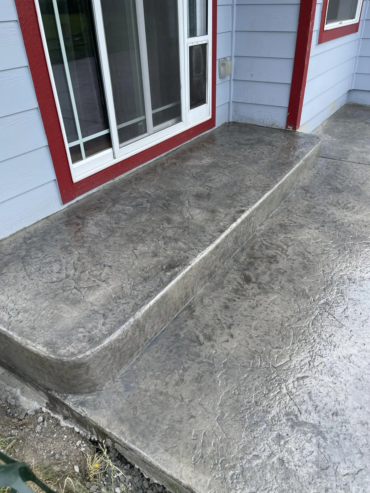 a concrete wall with white lines painted on it