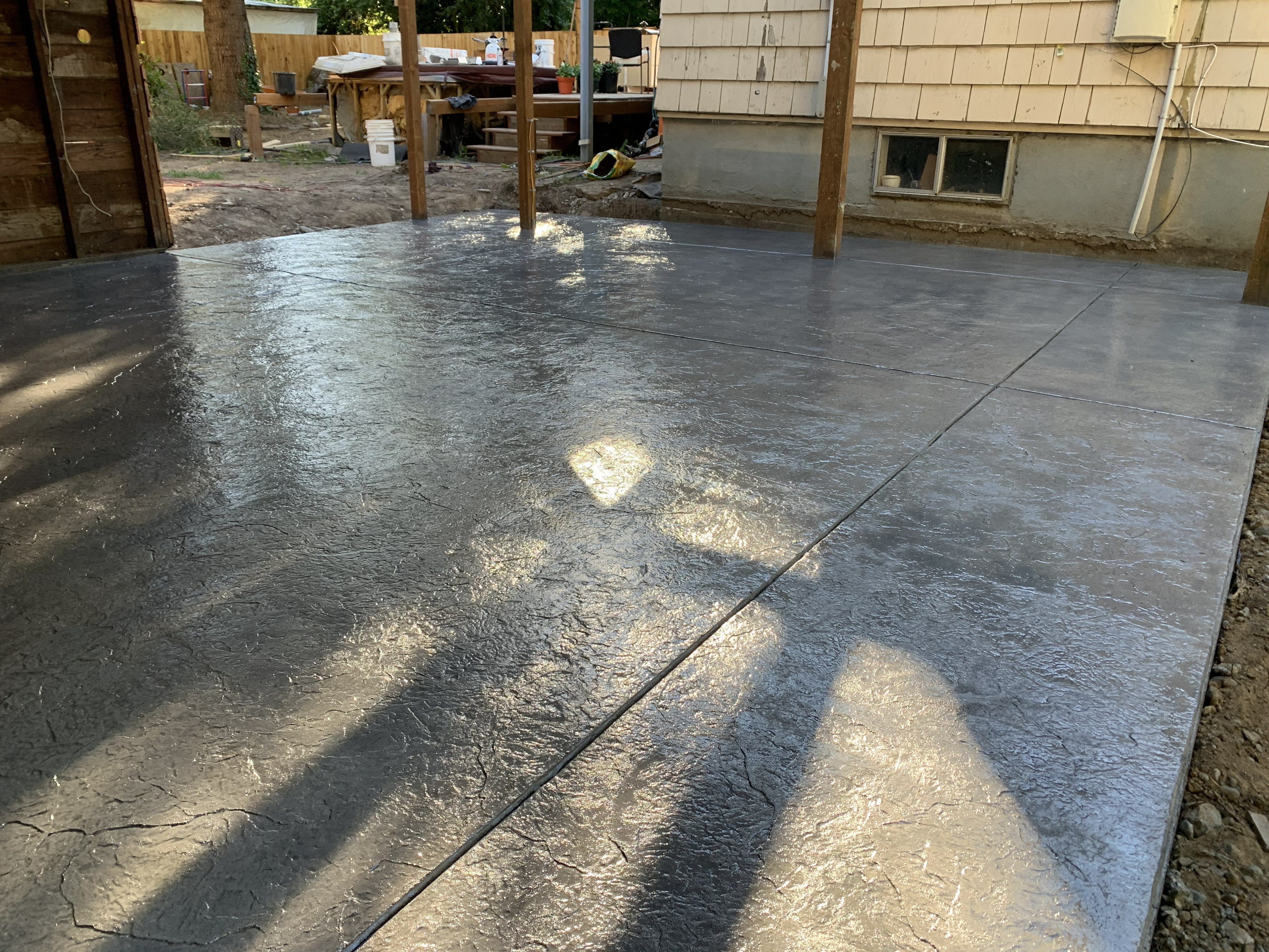 Construction workers in hard hats on a sunny day.