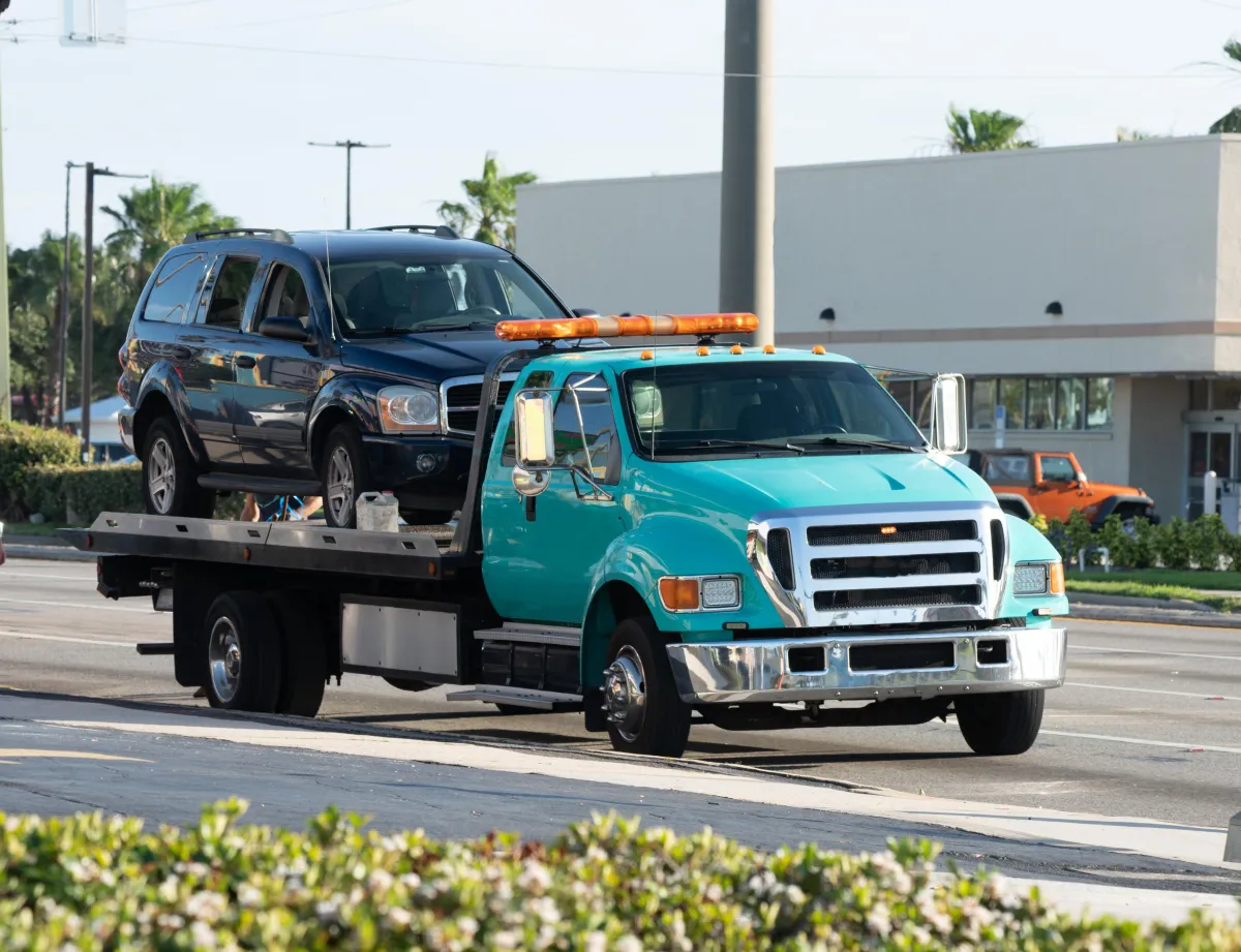 Tow Truck with SUV on its flatbed