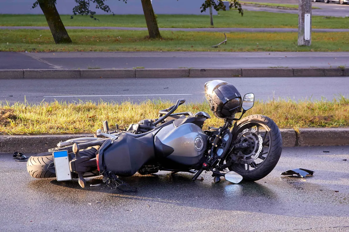 a motorcycle on the ground after a spill