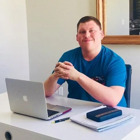 Entrepreneur at home office using laptop to grow online business