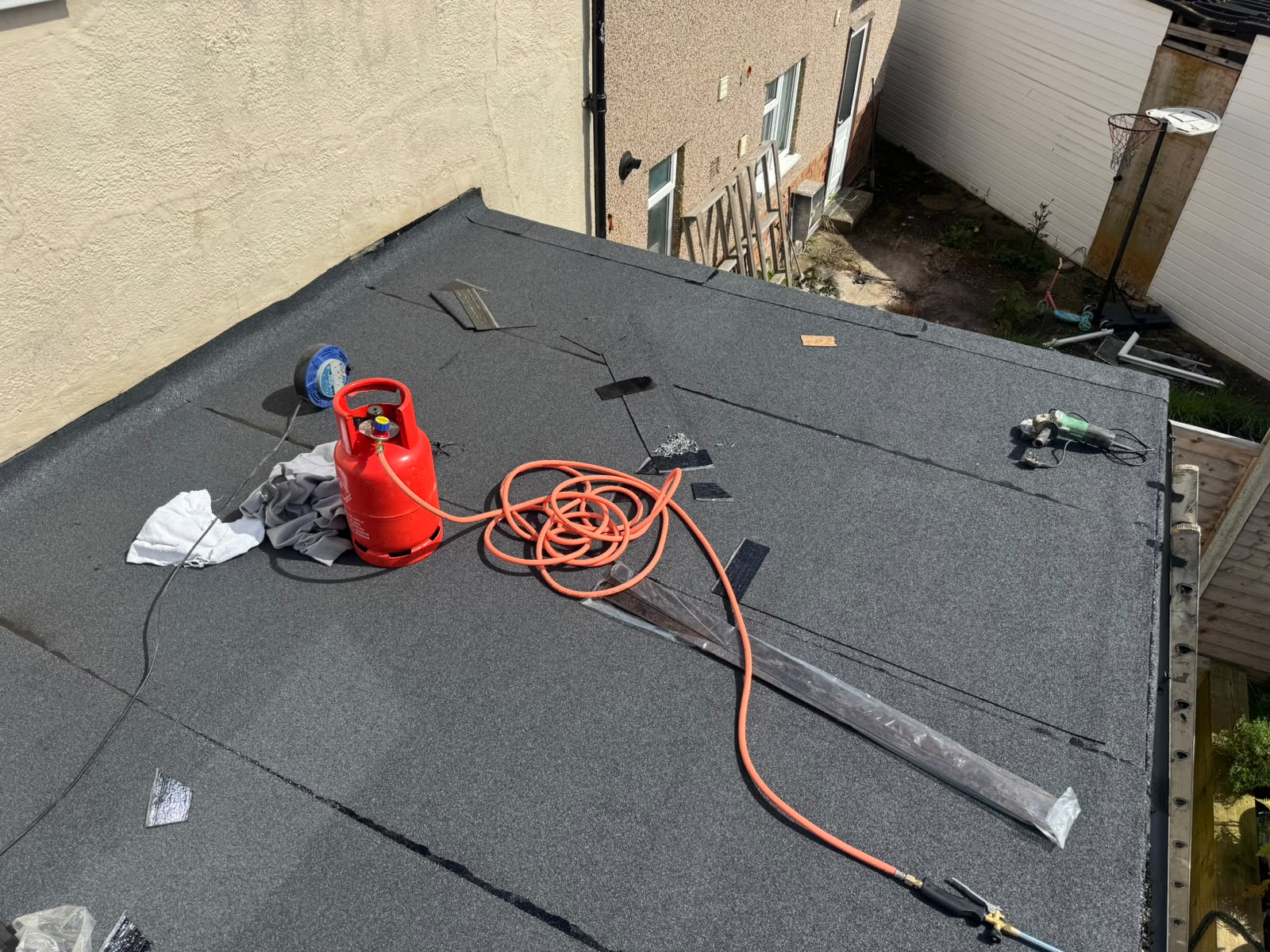 Roofing contractor in Salisbury replacing tiles on a pitched roof