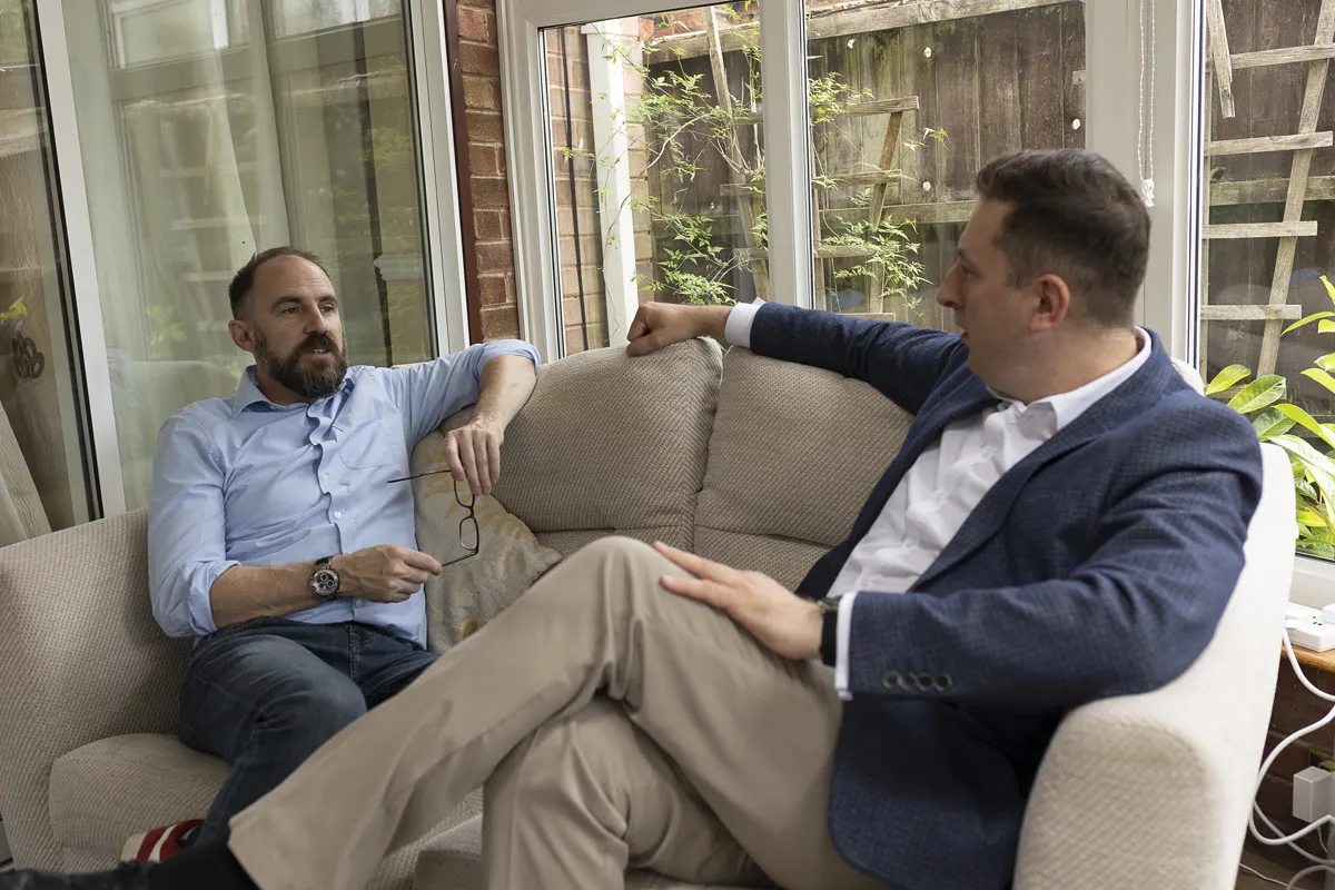 Nick Whitehouse working one to one with a client at a table