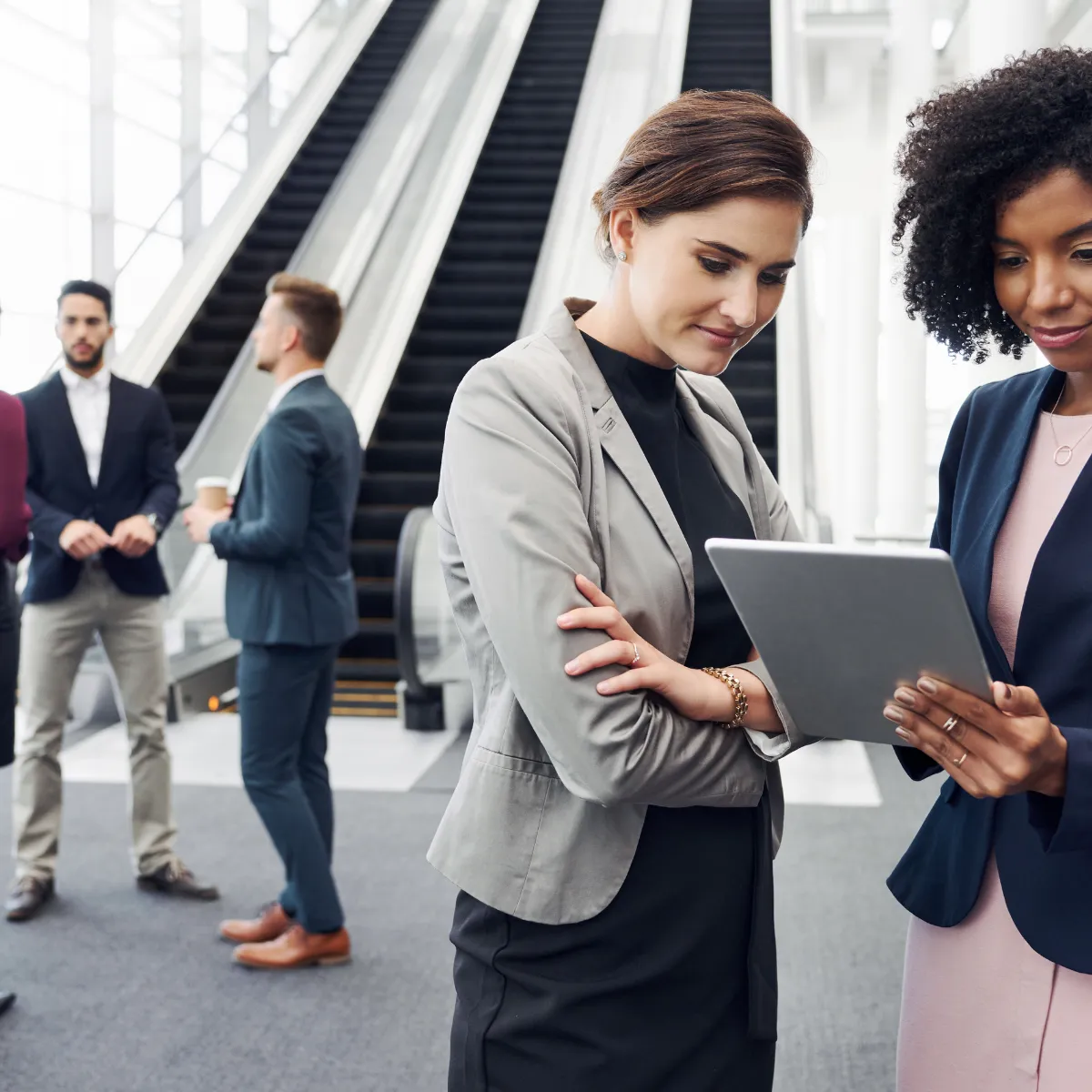 Team members talking in an office entrance