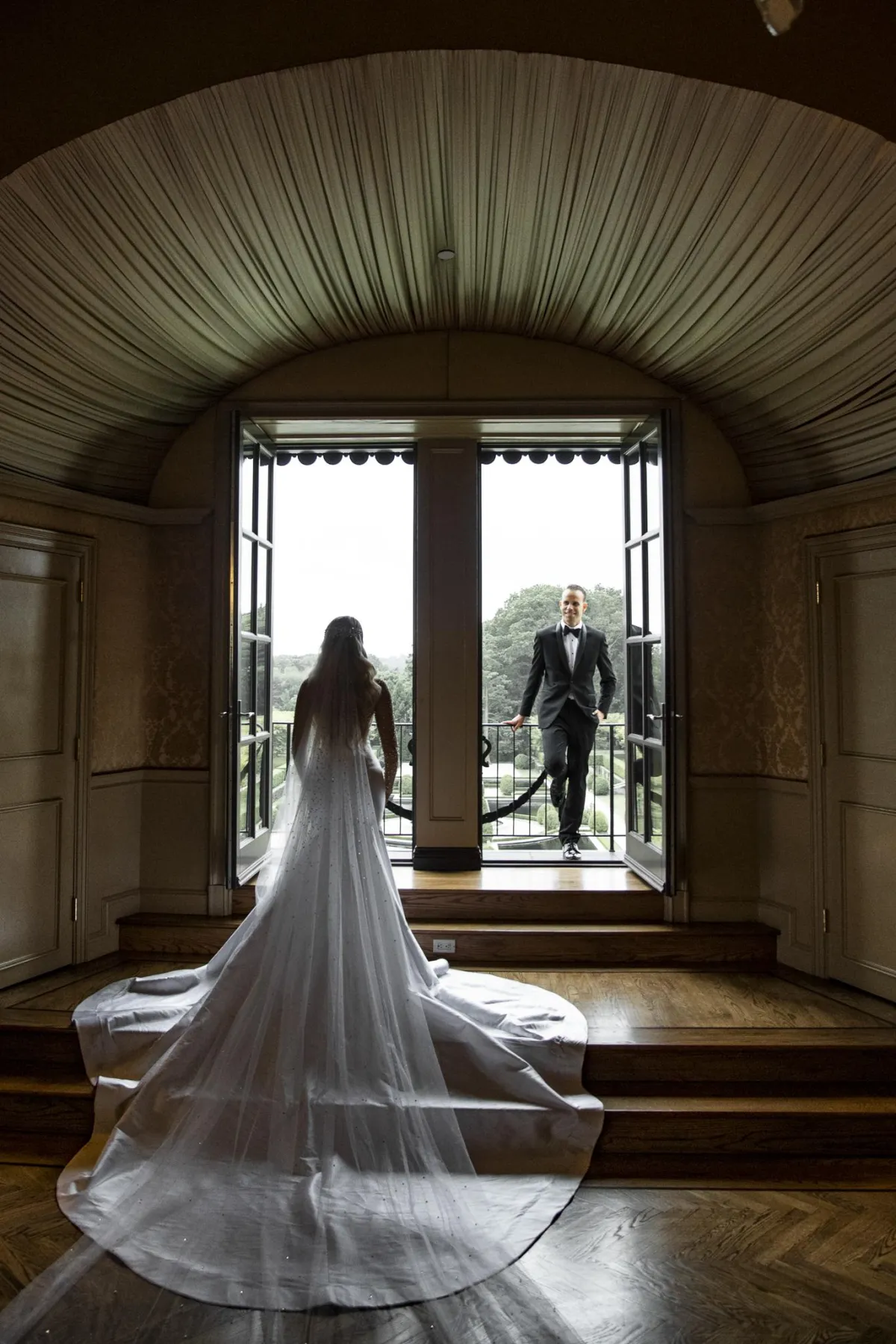 Oheka Castle wedding photographer bride and groom portrait by castle window Long Island NY by Lotus Wedding Photography