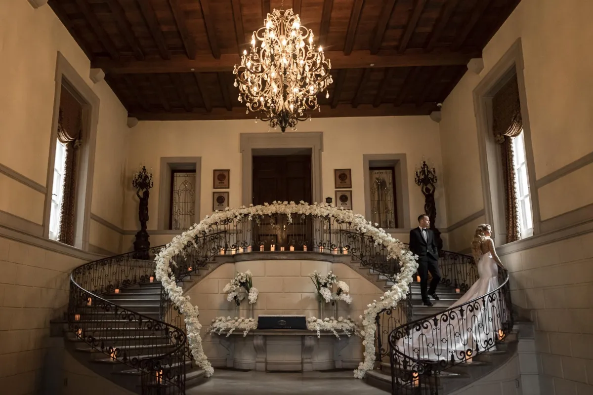 Oheka Castle wedding photographer bride and groom on grand staircase inside castle Long Island NY by Lotus Wedding Photography