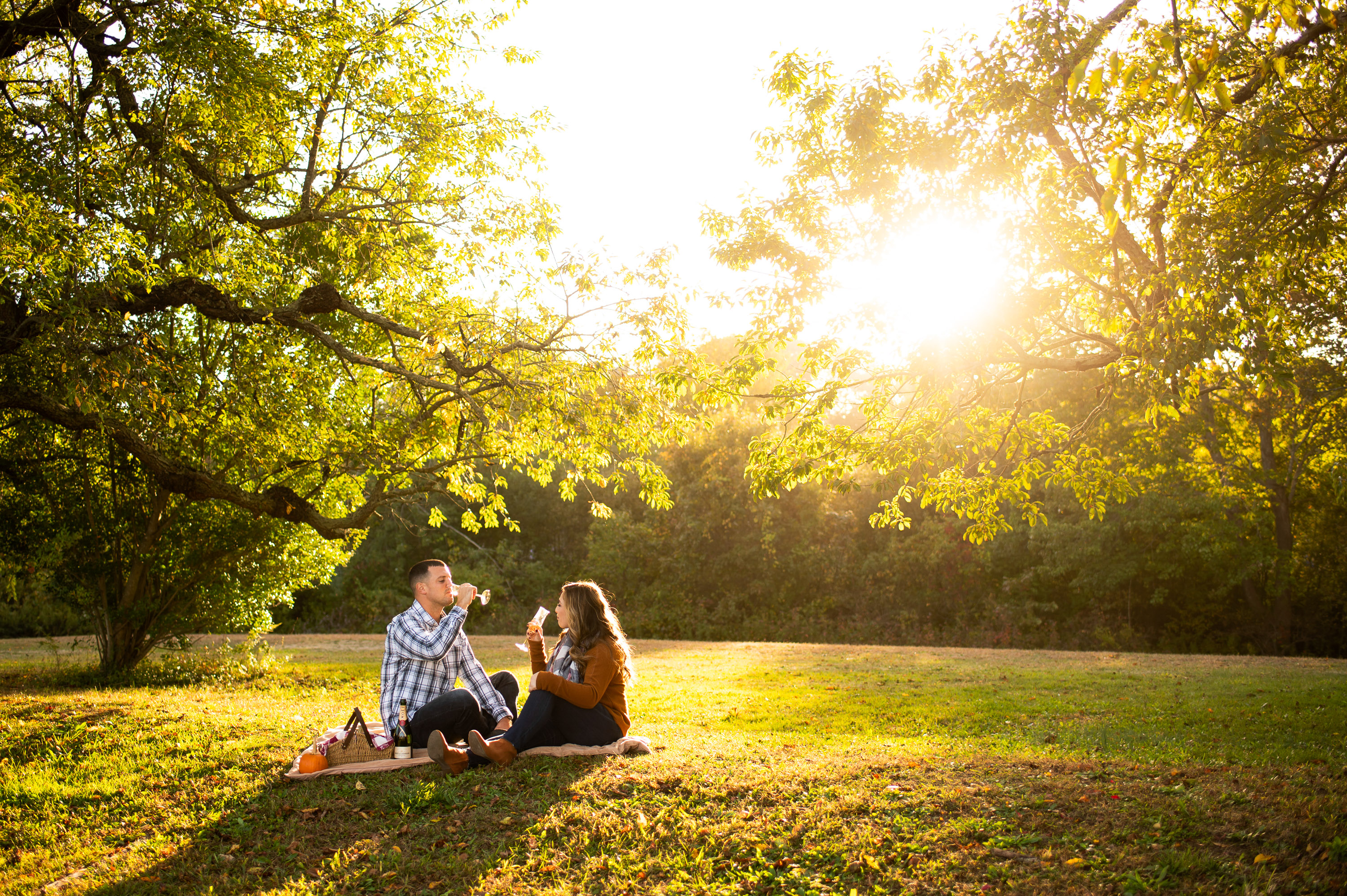 sunset picnic engagement photos at White Rock Lake Dallas photographed by Dallas engagement photographer Lotus Wedding Photography