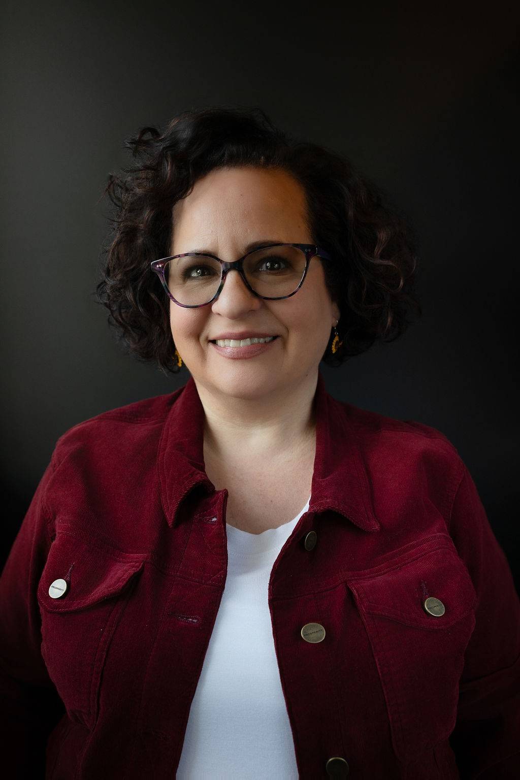Tracie Merwitzer, certified hypnotherapist and master life coach at The Butterfly Effect in Asheville NC, in a warm professional portrait.