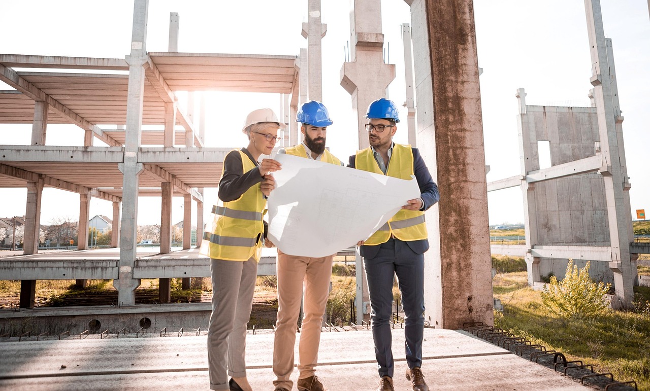  Three skilled tradespeople giving thumbs up representing career opportunities at Skilled Labor Contractor