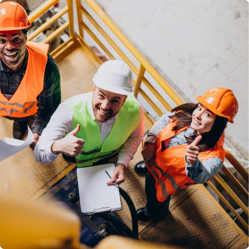Three Skilled Labor Contractor tradespeople giving thumbs up on a construction jobsite in North Georgia