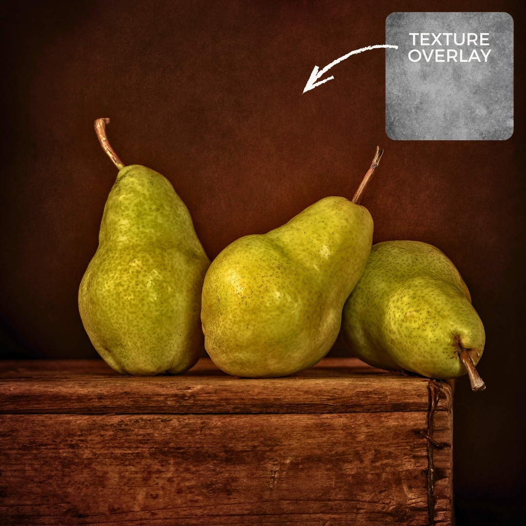 Still life photograph of green pears on a wooden surface with a textured background applied using a Photoshop texture overlay to add depth and painterly detail
