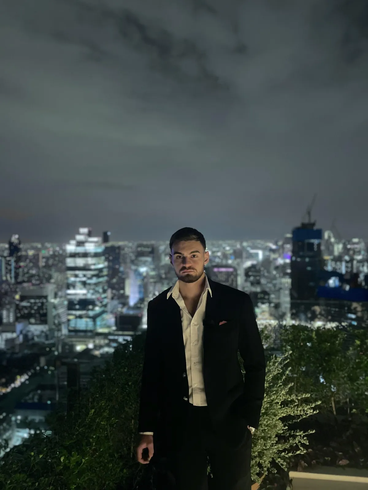 man in black jacket holding spark