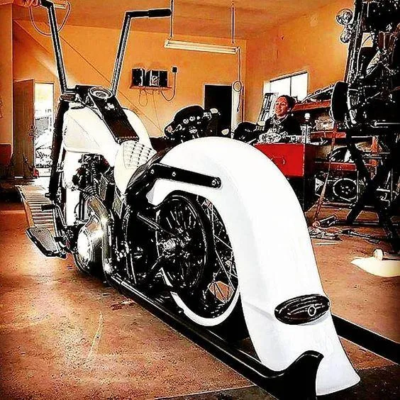 two motorcycles parked on the side of the road