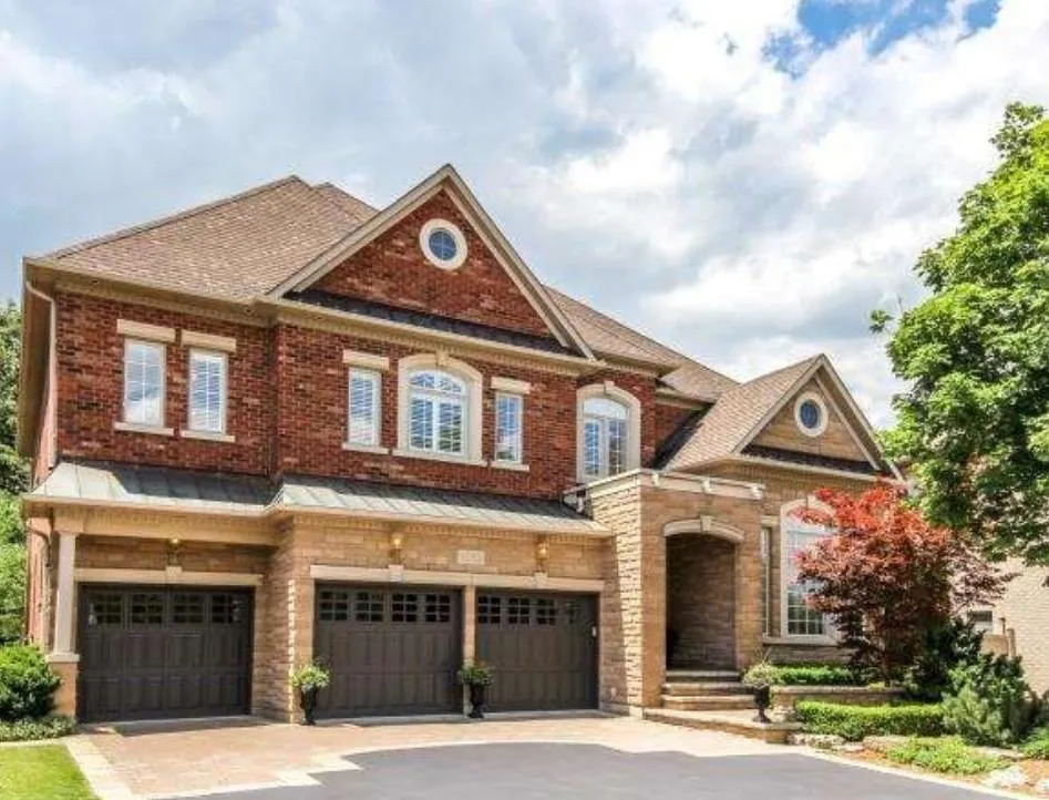 green trees near white 2-story house