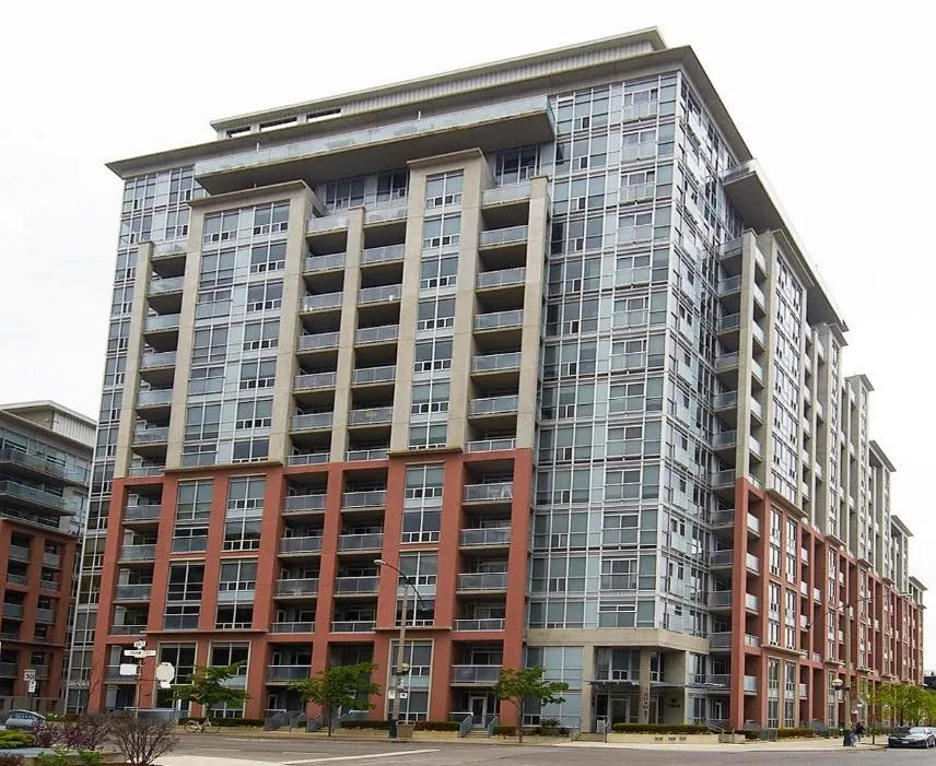 brown wooden framed yellow padded chair