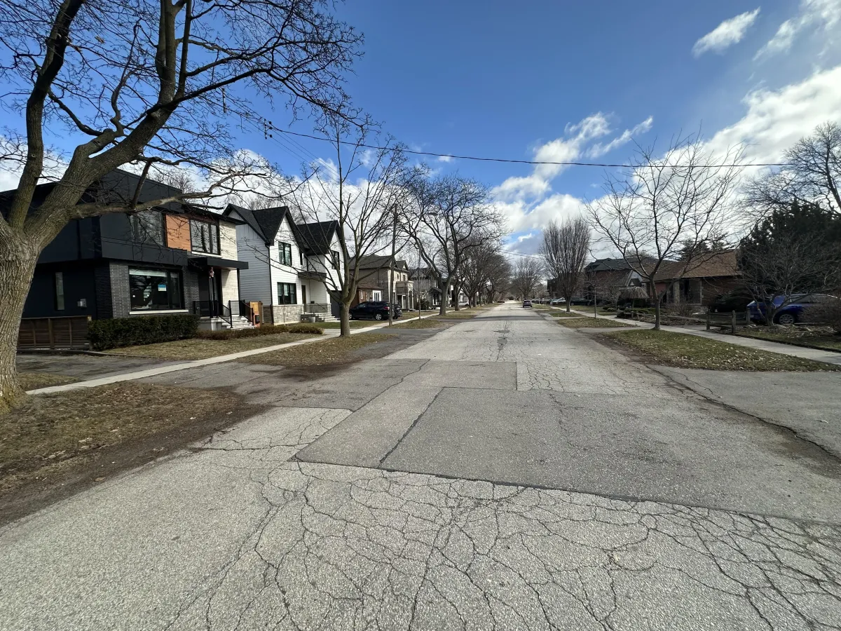 a modern house with a pool and lounge chairs