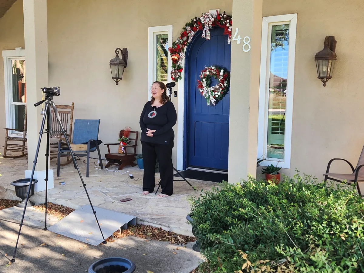 Melissa Hunt welcoming visitors to a family-based senior living home.