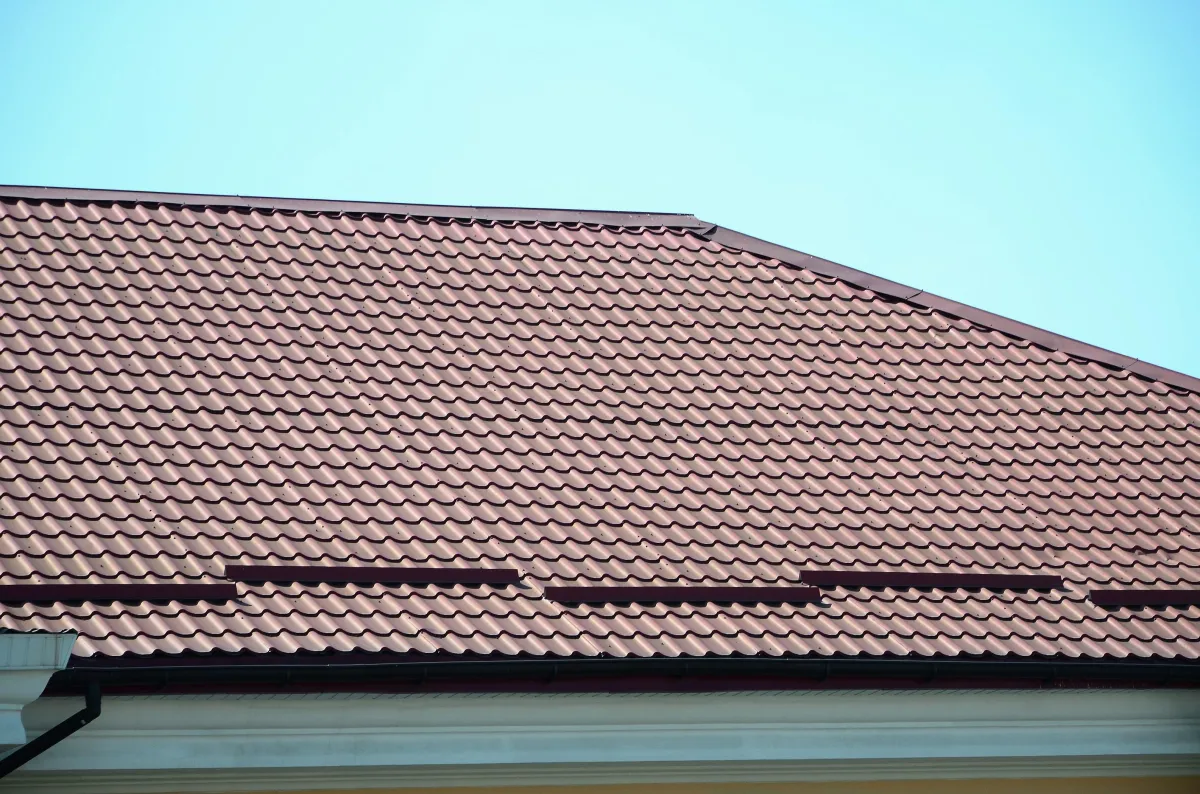 a-fragment-of-a-roof-from-a-metal-tile-of-dark-red