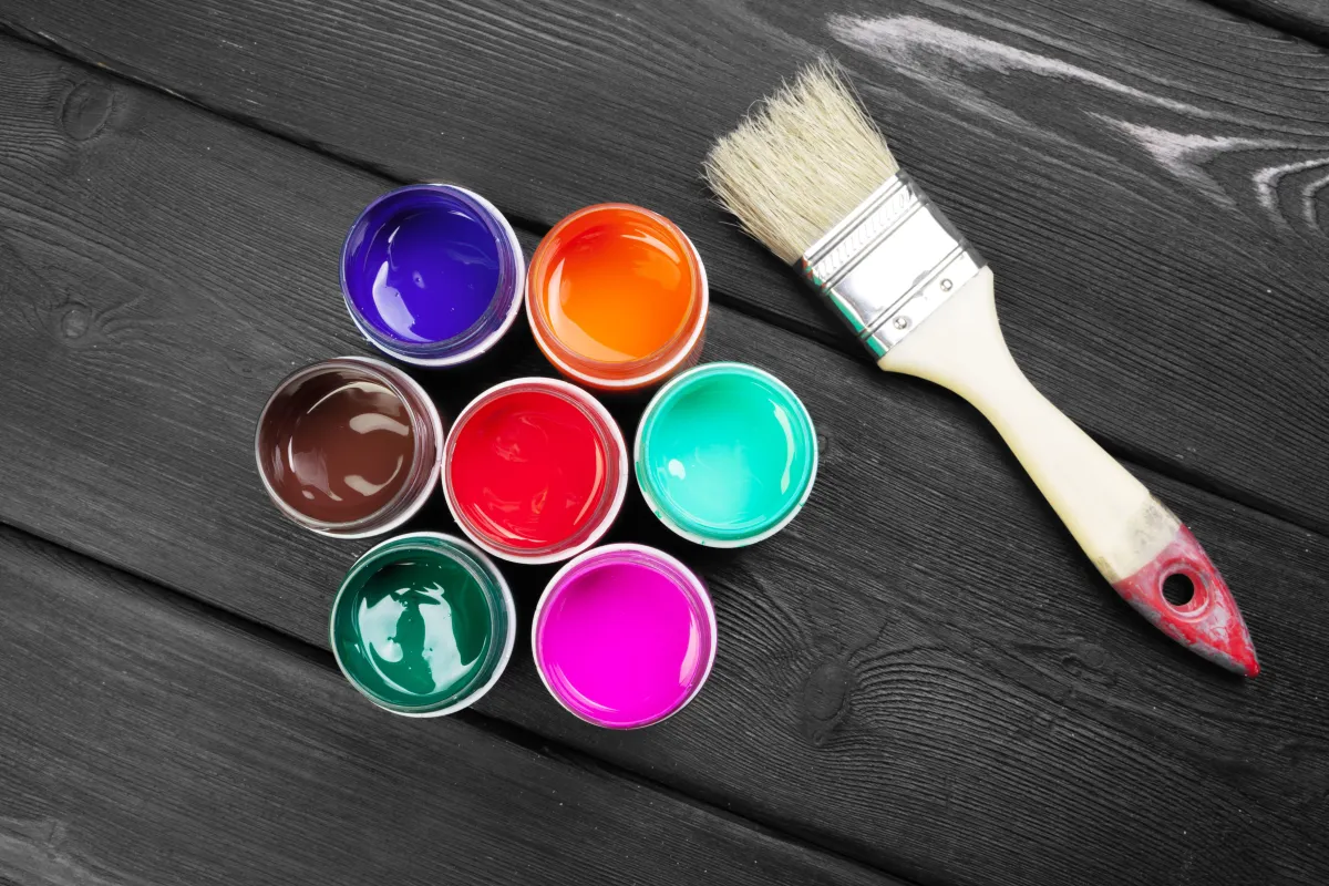 paint-bottels-on-rustic-wooden-background