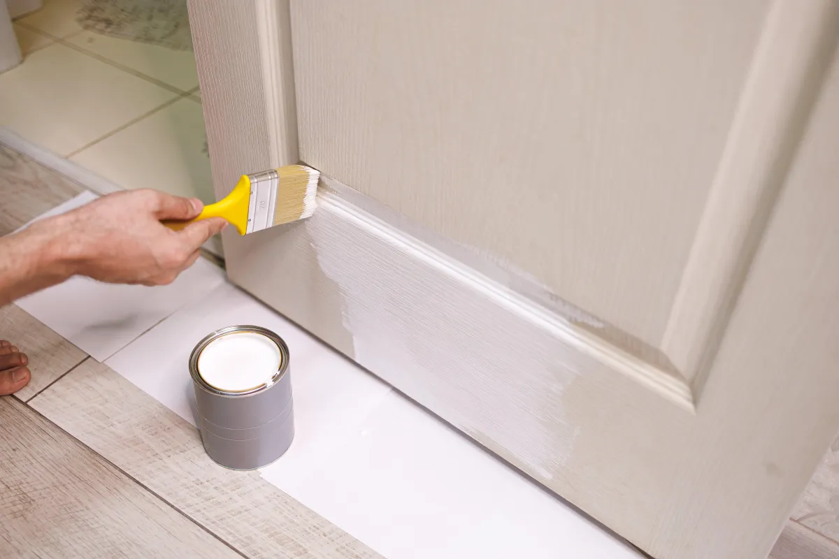 the-process-of-painting-doors-white-with-a-brush