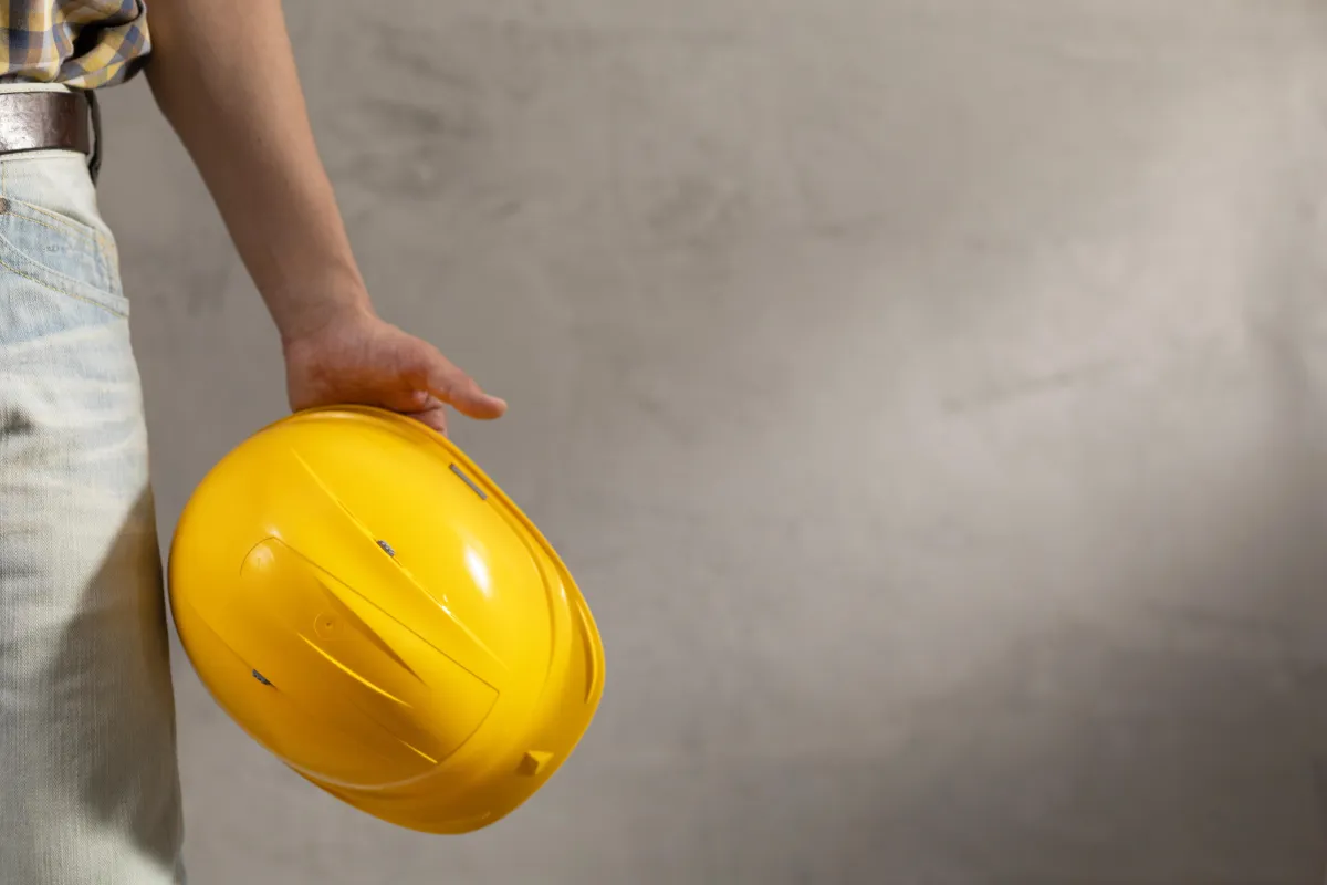 worker-man-holding-construction-helmet