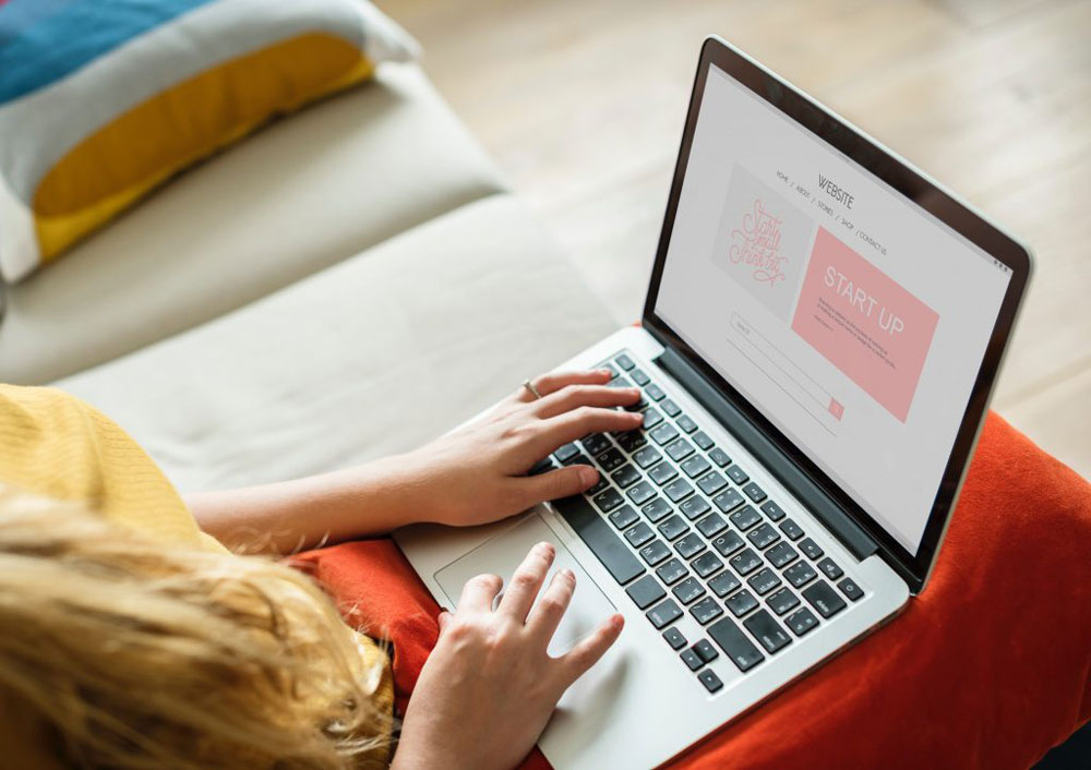 holding laptop