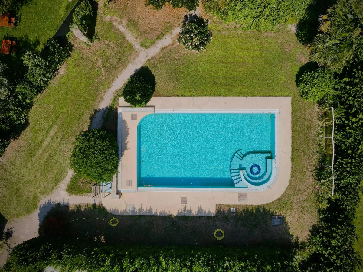 Pool installation with paved surround in a garden near Stourport on Severn