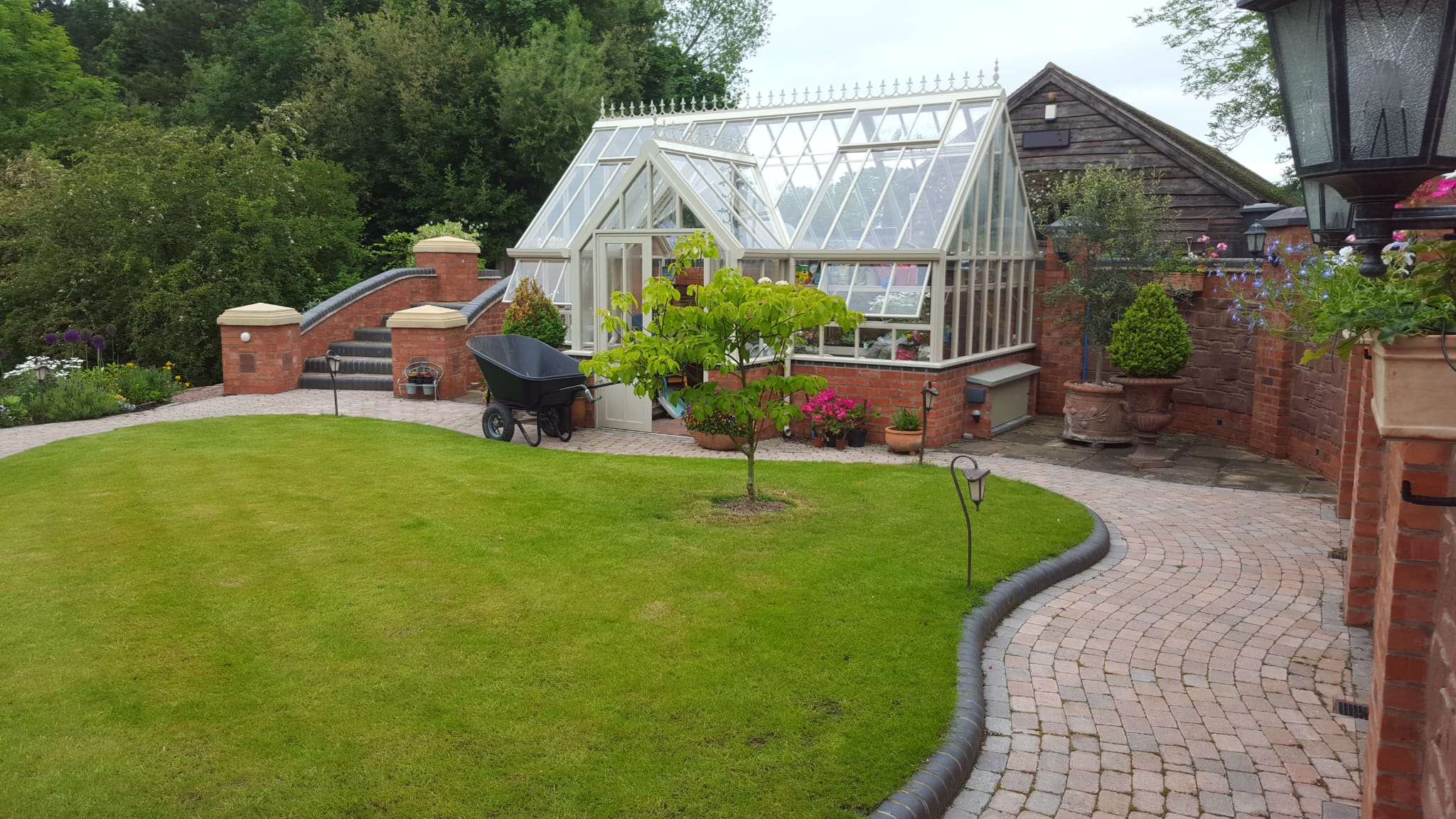 Hard and soft landscaping combining paving and planting in a Stourport on Severn garden
