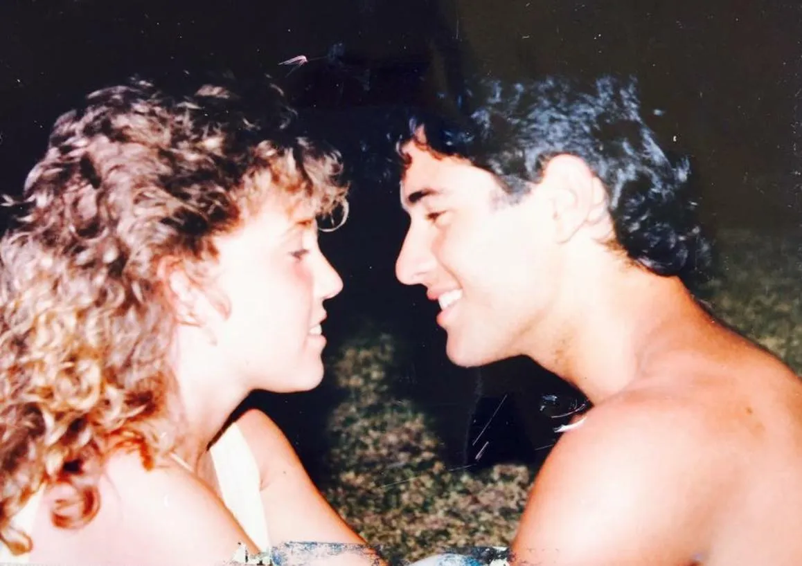 two men sitting on road
