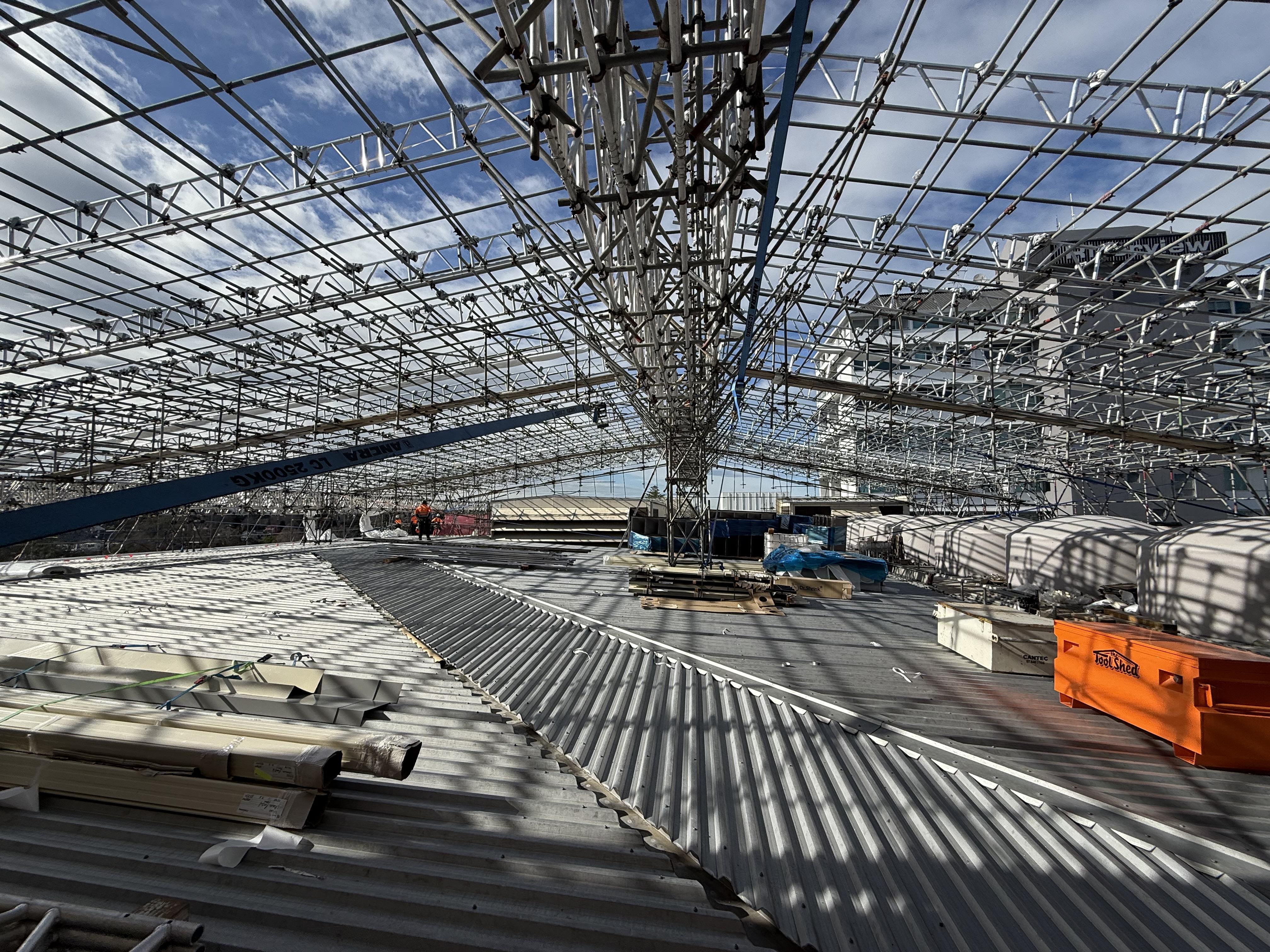 Temporary roofs and full building encapsulation