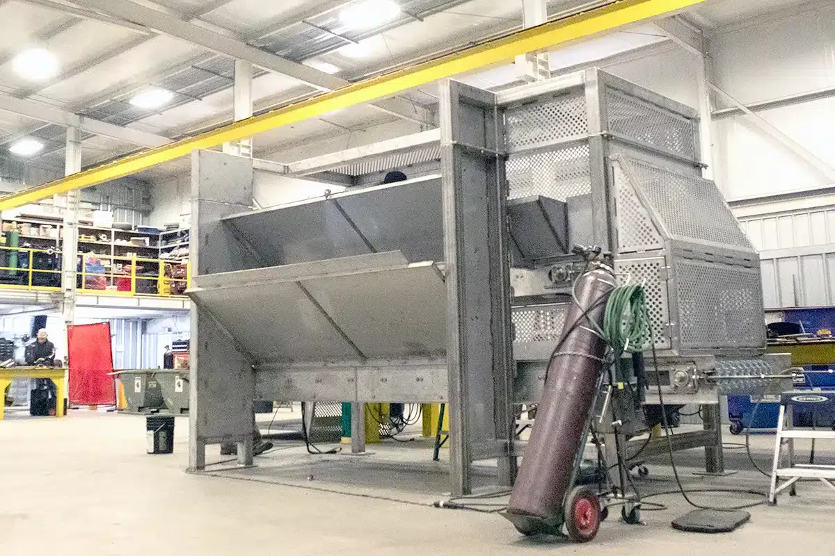Men loading wood onto a truck