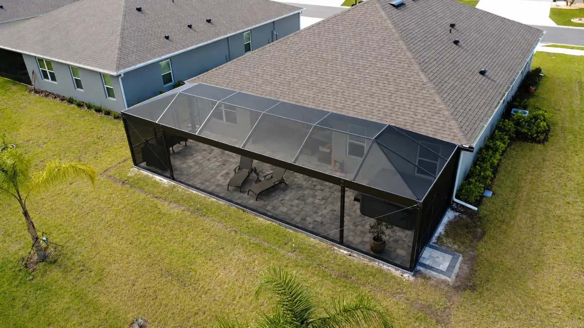 Custom aluminum lanai enclosure designed for modern Florida outdoor living spaces