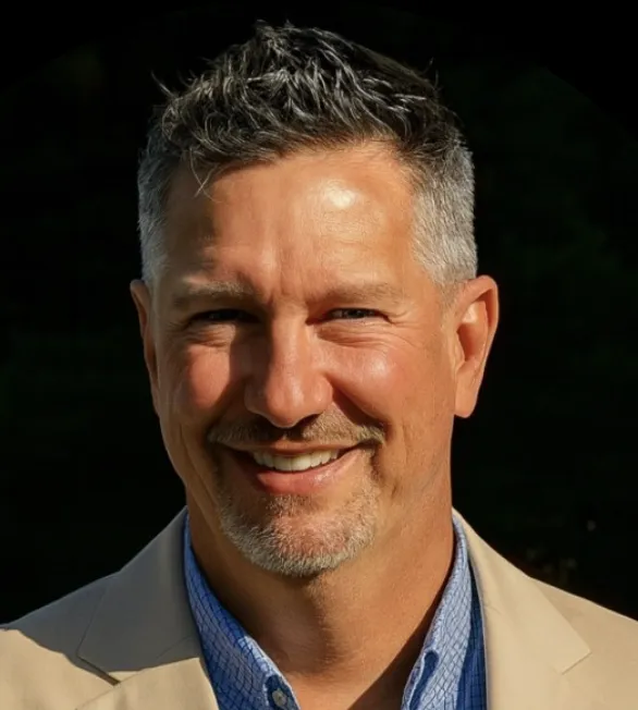 Smiling man giving a testimonial about business automation success.